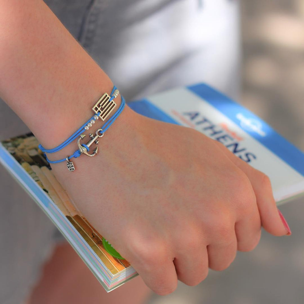Anchor Bracelet on a blue cord, worn while traveling
