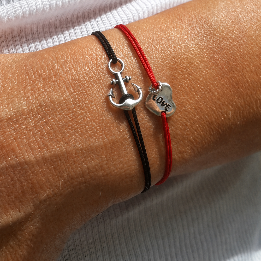 Anchor Bracelet on a black cord, worn on the wrist