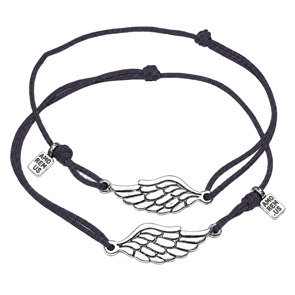 Matching couple bracelets — two sterling silver wing charms on charcoal cords, Second Wing set