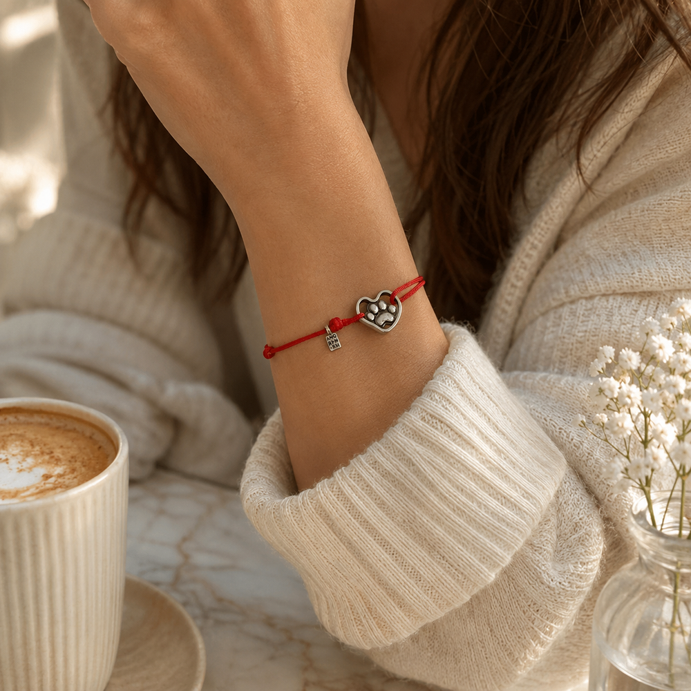 Paw Print Bracelet — sterling silver paw on a cord